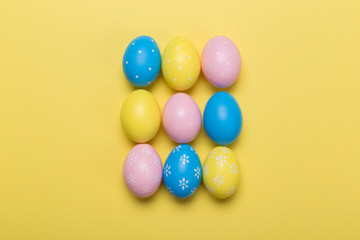 easter eggs on yellow pastel color background with space. Concept