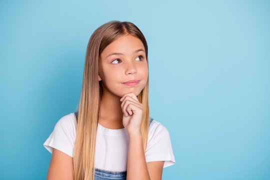 Close-up portrait of her she nice cute curious smart clever intelligent attractive minded straight-haired blonde pre-teen girl touching chin isolated on blue pastel background