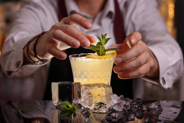 Barmen is making Fitzgerald cocktail
