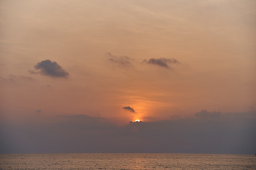 Beautiful sunset on the sea and sky with clouds.