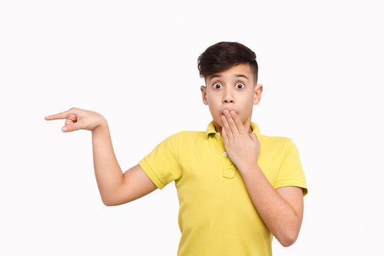 Shocked boy pointing aside