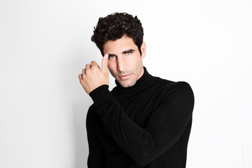 Handsome guy in black fashion posing for camera