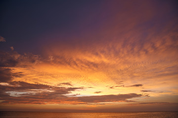 Beautiful sunset on the sea and sky with clouds.
