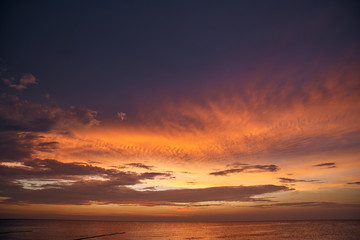 Beautiful sunset on the sea and sky with clouds.