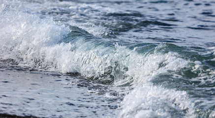 Waves on the seashore as an abstract background