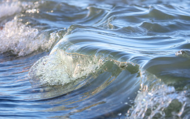 Waves on the seashore as an abstract background