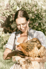 girl with chicken in hand