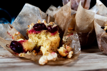 muffins on wooden board with dark background