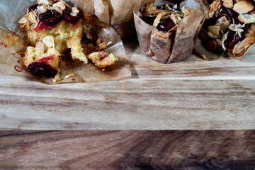 muffins on wooden board with dark background