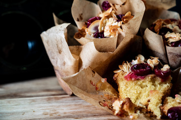 muffins on wooden board with dark background