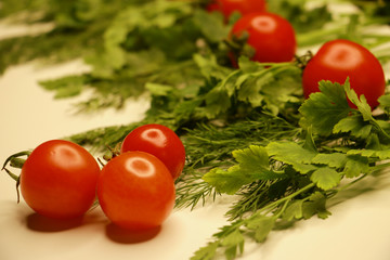 small tomatoes with greens