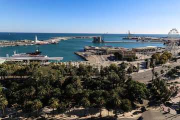 Fototapeta na wymiar The port of Málaga with the park in the foreground and the clear blue sky in the background