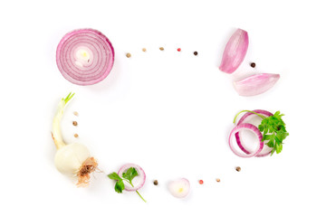Red and white onions, shallots, parsley leaves and peppercorns, shot from the top forming a frame on a white background with a place for text