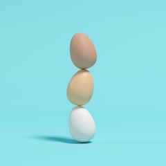 Stacked eggs on blue background. Minimal Easter concept idea. - 250229568