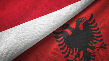 Indonesia and Albania two flags textile cloth, fabric texture