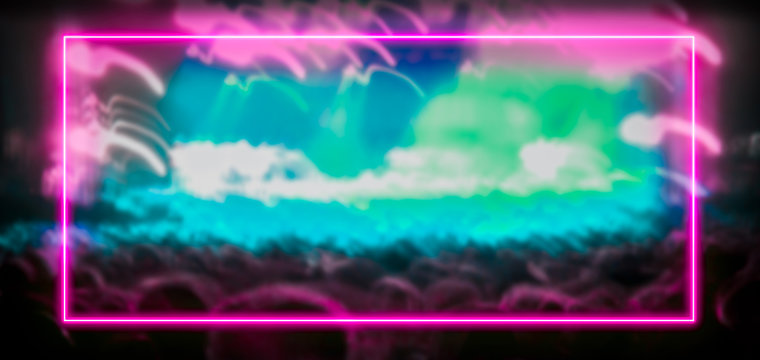 Pink and turquoise neon light frame with crowd at festival concert in the background. Copy space for text or product display. - Powered by Adobe
