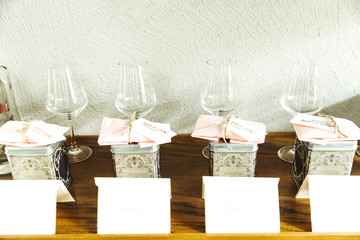 Boxes with tea stna dbefore the glasses on a table