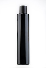 A black small bottle with an opaque cover from under the conditioner