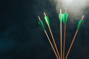Five wood arrow. Beautiful smog background. Medieval weapons are handmade.
