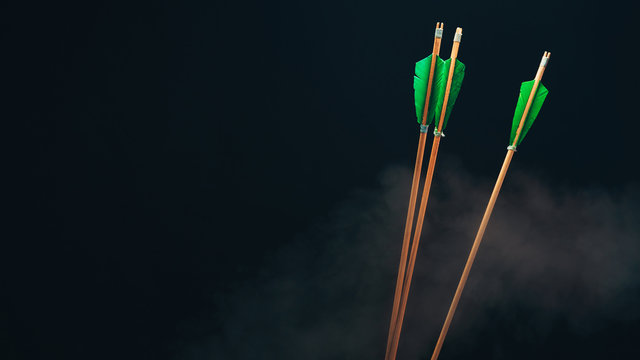 Three wood arrow. Beautiful  smog background. Medieval weapons are handmade.