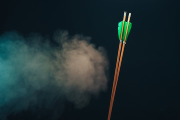 Two wood arrow. Beautiful smog background. Medieval weapons are handmade.