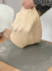 Stretching dough for pizza