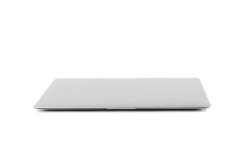 the closed laptop isolated on a white background