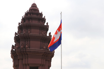 Cambodia flag and Independence Monument in Phnom Penh, An Angkor style tower