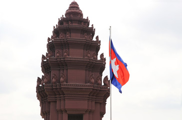Cambodia flag and Independence Monument in Phnom Penh, An Angkor style tower