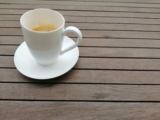 cup of coffee on wooden table