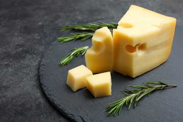 Fototapeta yellow Maasdam cheese with rosemary obraz