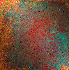 concrete detail painted with colorful yellow, green, turquoise, red. grunge wall cement texture