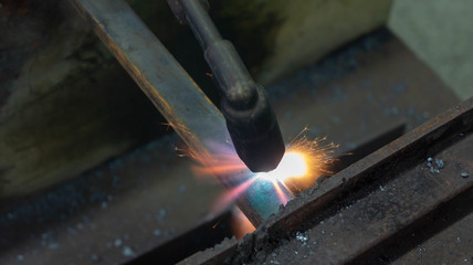 Oxy-acetylene gas welding or cutting in a metal workshop