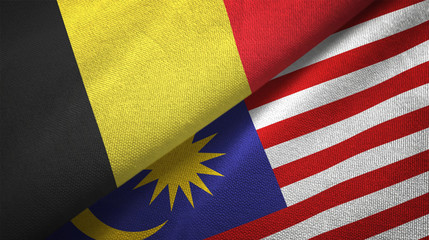 Fototapeta premium Belgium and Malaysia two flags textile cloth, fabric texture