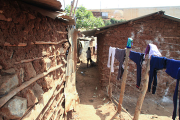 Kibera, Nairobi, Kenya - February 13, 2015:clothes are drying on ropes in the slums of Nairobi - one of the poorest places in Africa - obrazy, fototapety, plakaty