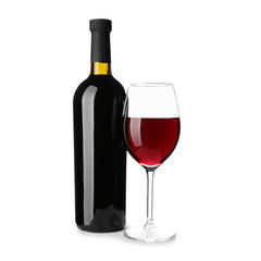 Bottle and glass of tasty wine on white background