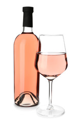 Bottle and glass of tasty wine on white background