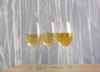 Glasses of tasty wine on table