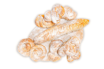 sweet buns sprinkled with powdered sugar on wooden Board isolated on white background