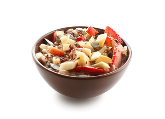 Bowl with tasty oatmeal on white background