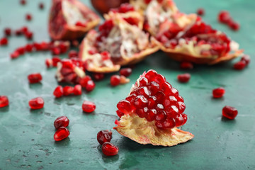 Piece of ripe pomegranate on table