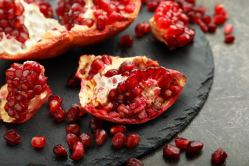 Pieces of ripe pomegranate on table