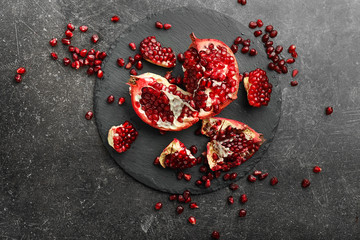 Pieces of ripe pomegranate on table