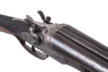 Vintage double-barreled hunting rifle isolated on a white back.