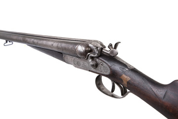 Vintage double-barreled hunting rifle isolated on a white back.