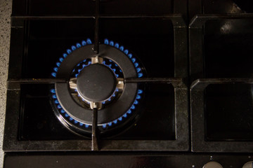 Combustion of natural gas in the burner on a dark background