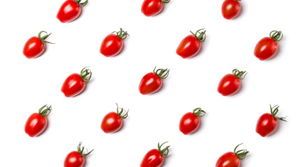 Food pattern of cherry tomato isolated on yellow background. Flat lay, top view.