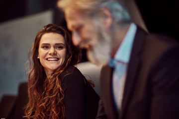 handsome caucasian senior CEO at a meeting with his young beautiful apprentice. Job interview