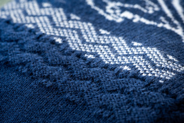 Knitted fabric, blue and white pattern.