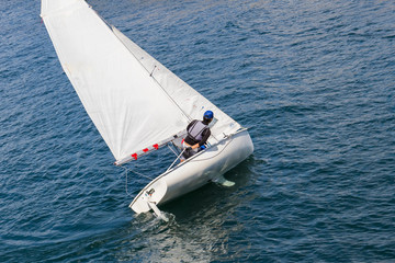 Naklejka premium white yacht with sails in the Sea.